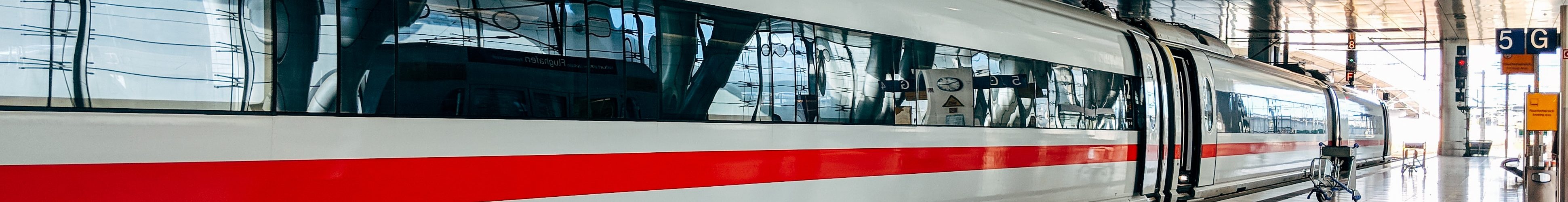 white and red train during daytime