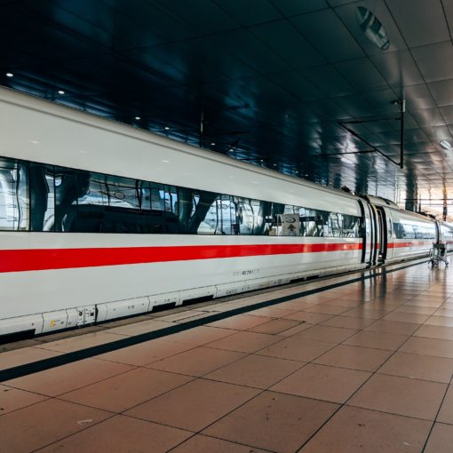 white and red train during daytime