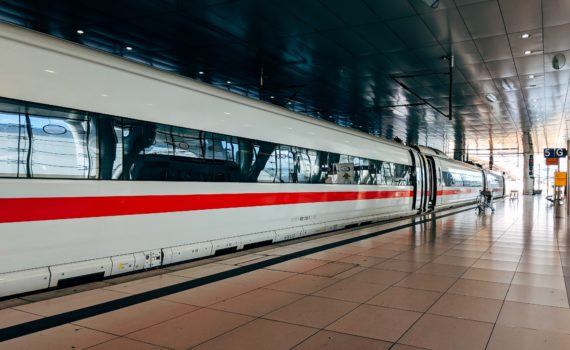 white and red train during daytime
