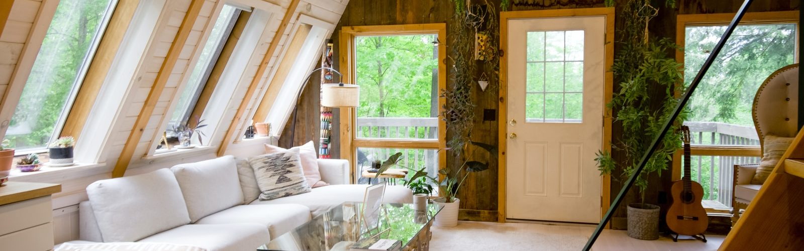 white sofa set near window